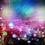 Internet of Things connecting in cloud over city scape.