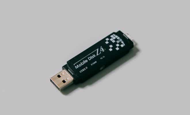 black usb flash drive on white surface
