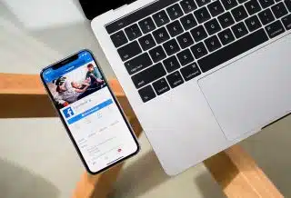 iPhone X beside MacBook