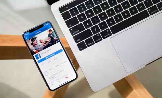 iPhone X beside MacBook